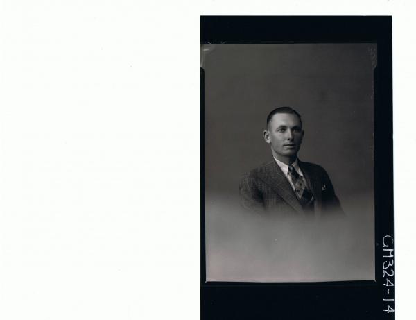 H/S Portrait of man wearing shirt, tie and jacket; 'Telic Mit'