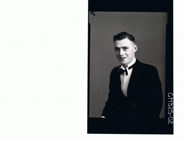 1/2 Portrait of man standing wearing three piece suit, 'Uybo'