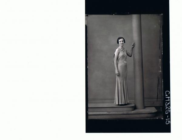 F/L Portrait of woman standing wearing long evening dress; 'Lodding'