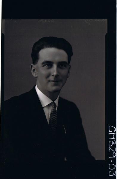 H/S Portrait of man wearing shirt, tie, jacket; 'Manley'