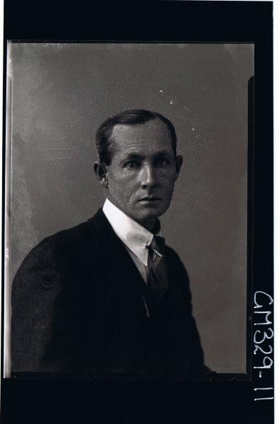 1/2 Portrait of man wearing three piece suit; 'Moore'