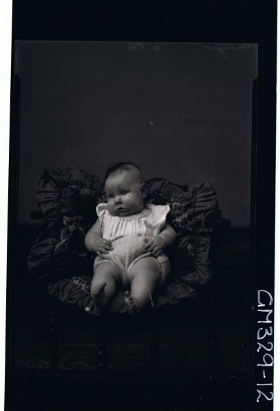 F/L Portrait of baby seated wearing knitted pants, top. 'Monger'