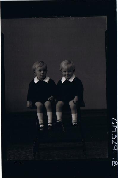 F/L Portrait of two male children, seated, both wearing shorts and shirts; 'Morris'