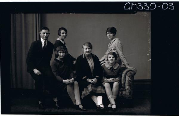 F/L Group Portrait of elderly lady, girl,young woman and young man seated,2 young women seated on back of couch'Buckman'