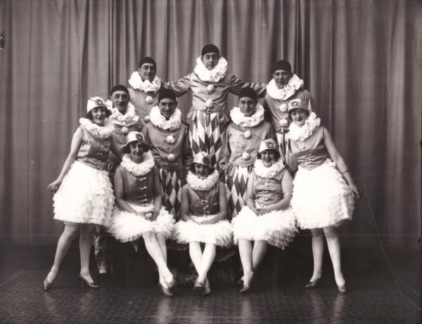 Group portrait of fancy dress group, 'Hollister Fashion Plates' Dwyer index, men and women in costume.