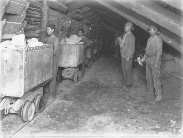 Underground workings and men at Perserverance gold mine.
