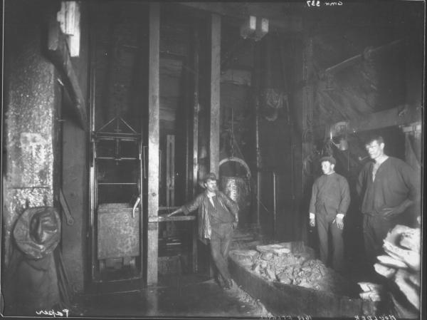 Great Boulder shaft, 1600 foot level, with workers, ore bins and kibble.