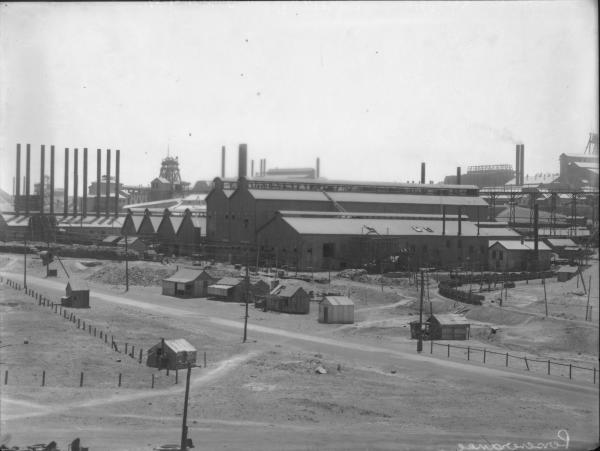 View of Perseverance Gold Mine showing Headframe, Chimneys and Associated Mine Buildings.