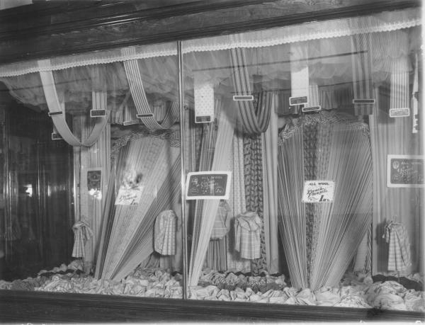 Brennan Bros shop window displaying assorted materials.