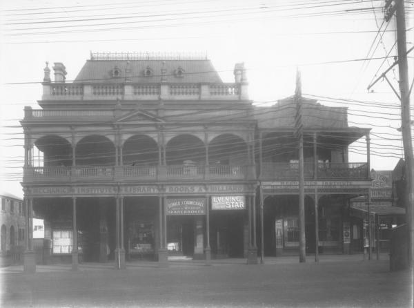 Mechanics Institute 'Library, Books & Billiards' building with 'Auctioneers' 'Reliable Seeds'  'Donald J. Carmichhael, Solicitor to Ward & Co., Sharebroker'  'Evening Star, Advertising Office'  'Vincents Cafe, - - Cakes' :'Dunnes Tea Rooms' 'Western House, --ring Co, T.E.Woods Manager' on various shop fronts.