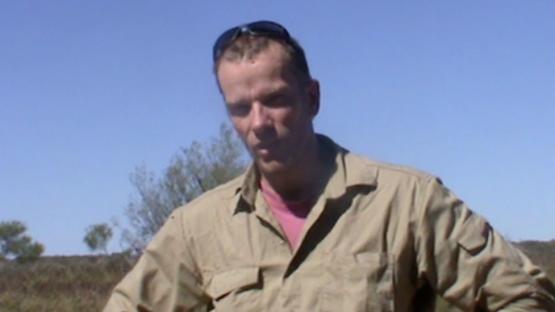 Mikael Siversson talking to camera in the Australian outback