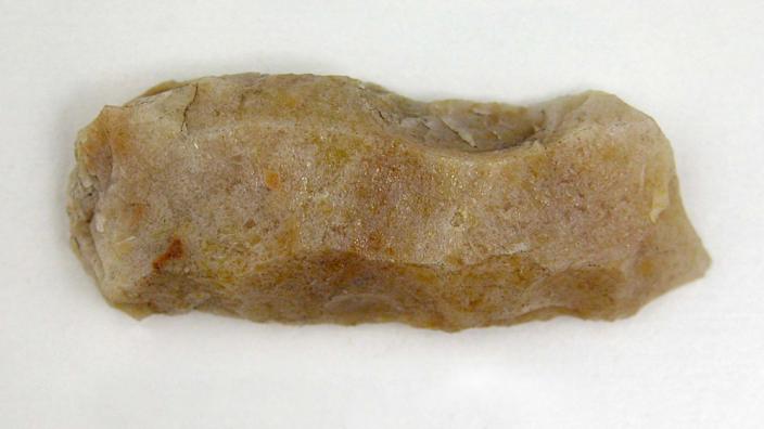 A stone artefact with resin