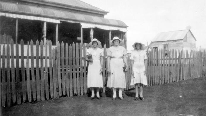 Mrs Radanovich with her daughters in front of their home before the riots, 1934