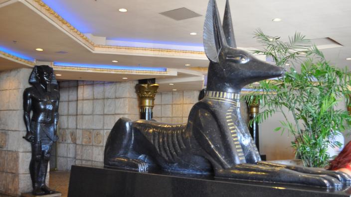 A statue of Anubis guarding the entrance to a Casino
