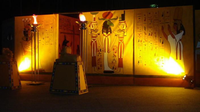 An ancient Egyptian themed wall with low lighting