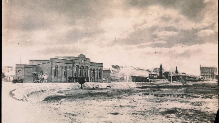 Sepia photo of old Perth Railway Station and vacant land 