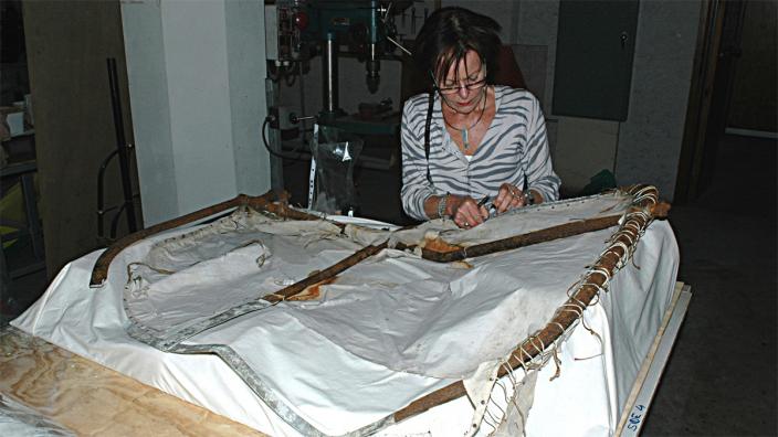 WA Museum conservator Ulli Broeze-Hoernemann working on Mawson’s air tractor