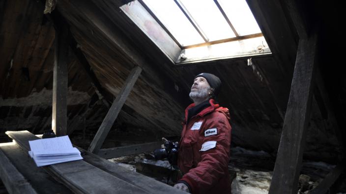 Dr Godfrey inspecting the hut in 2012