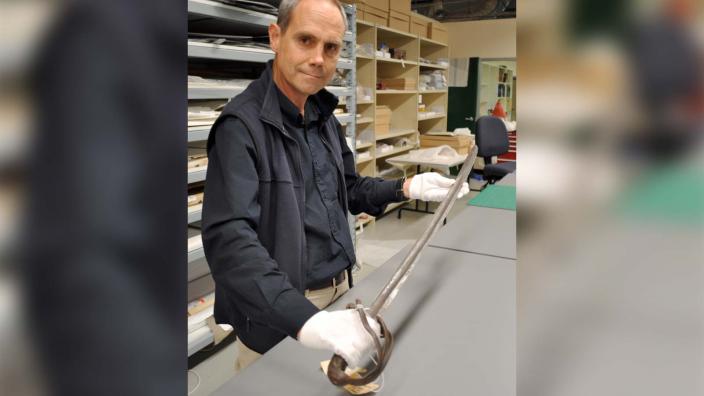 Stephen Anstey with the 17th century sabre used by Henry Dyson Naylor