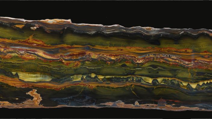 A polished slab of Brockman tiger eye chert from the Marra Mamba Iron Formation, Pilbara, Western Australia (2.4 m long). Donated by David Vaughan and Junko Matsuzaki. WA Museum specimen number R1.2019