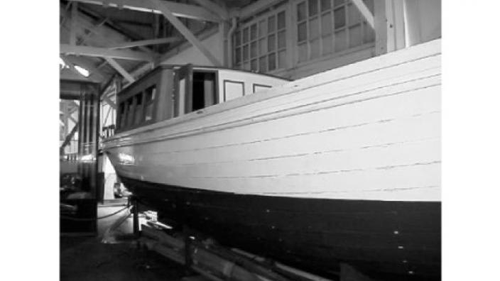 A large steam boat, moored onshore