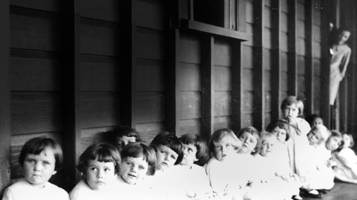Small children waiting to be immunised at Nudgee Orphanage, Brisbane, about 1928