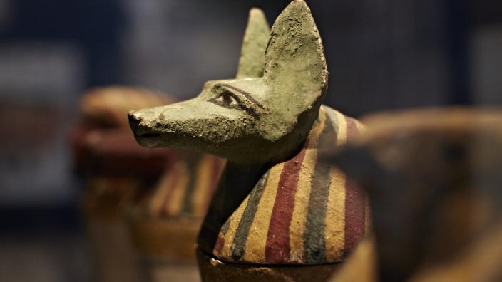 Close-up view of a dog-like Egyptian statue