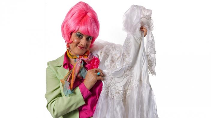 Ms Mavis Hamm showing off bridal wear