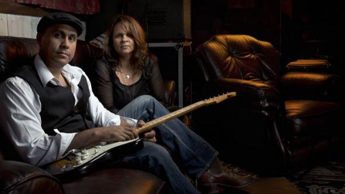 Two musicians posing for a band photograph