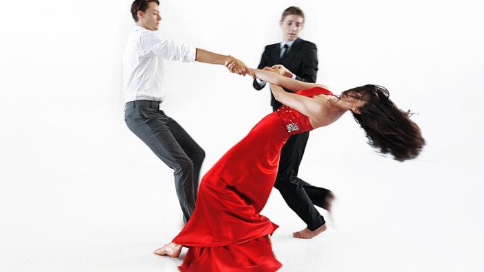 Two people swirling into a dance