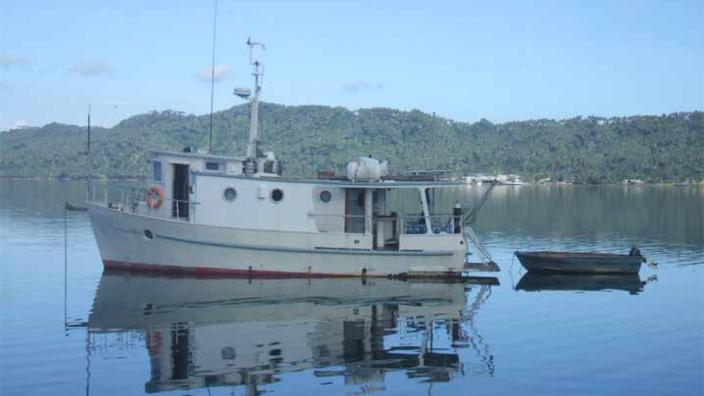 A ship anchored on a calm harbour