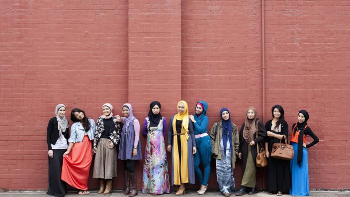 Muslim fashion bloggers Delina Darusman-Gala and Mya Arifin with a group of friends. Photo by Marinco Kojdanovski. © Powerhouse Museum, Sydney.
