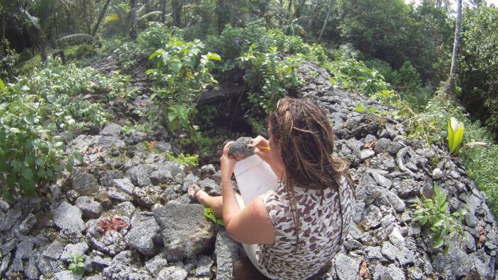 WA Museum's Dr Zoe Richards examining corals at one of the ancient Leluh tombs