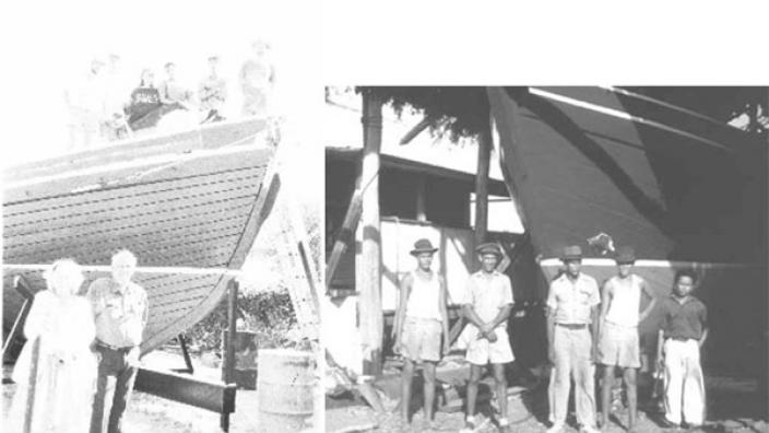 A crowd of people standing next to the boat they created