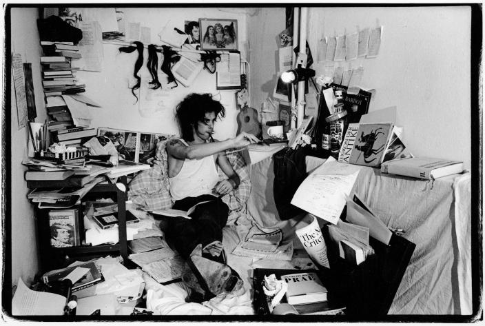 Nick Cave seated in a heavily decorated room