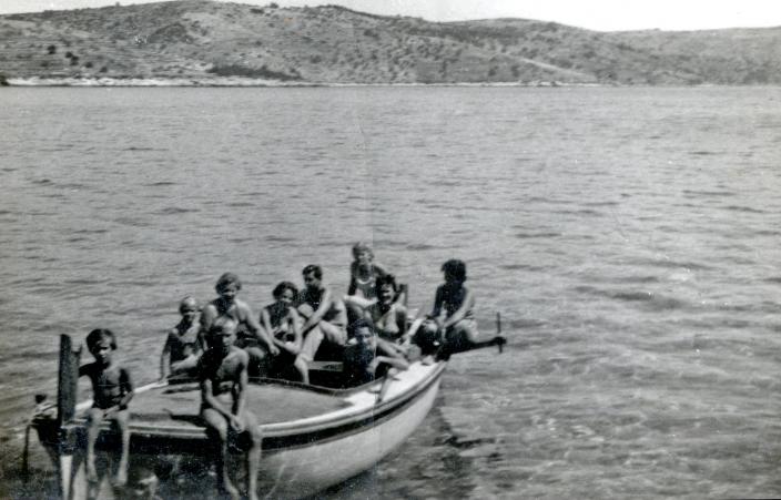 The small family boat carrying Nada, her family and their picnic 
