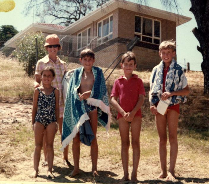 Stephen, his mother and siblings standing in bathers at Bicton Baths 