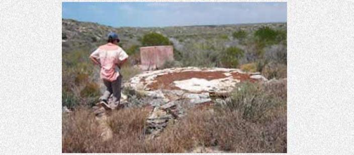 Scientists examining the site of the Sammy Well's campsite.