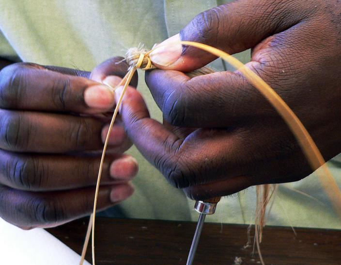 Preparing a coil stitch.