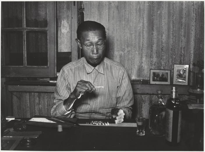 A Chinese pearl dealer in his Broome store. 
