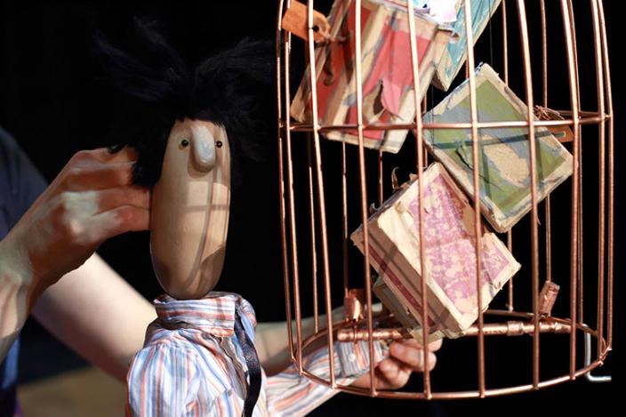 Puppet with suitcases