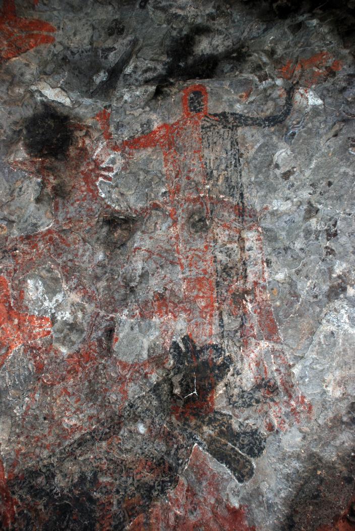 Cueva del Raton black faced red man above panther