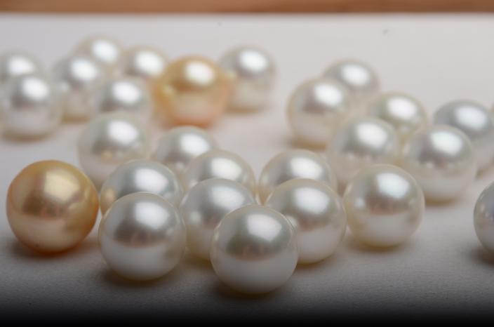 A group of different coloured pearls. 