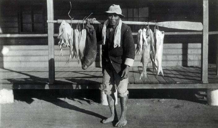 A man selling fish. 