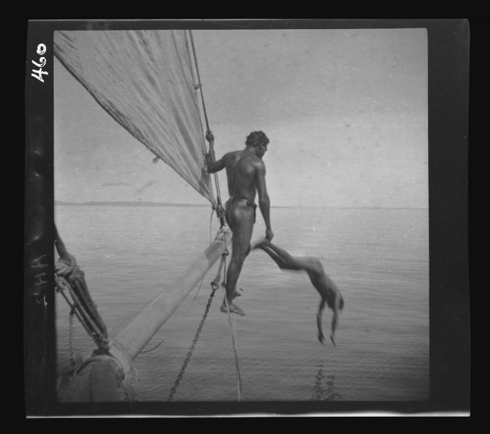 Men diving from a boat