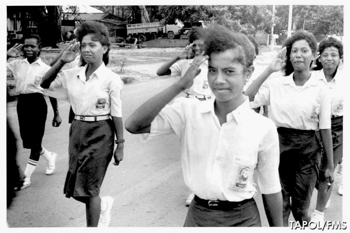 Students from Escola Female Secondary School parading in Dili in June 1990. 