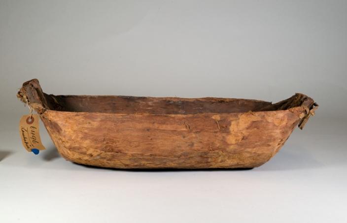 Long wooden handcrafted bowl in the shape of a long deep dish