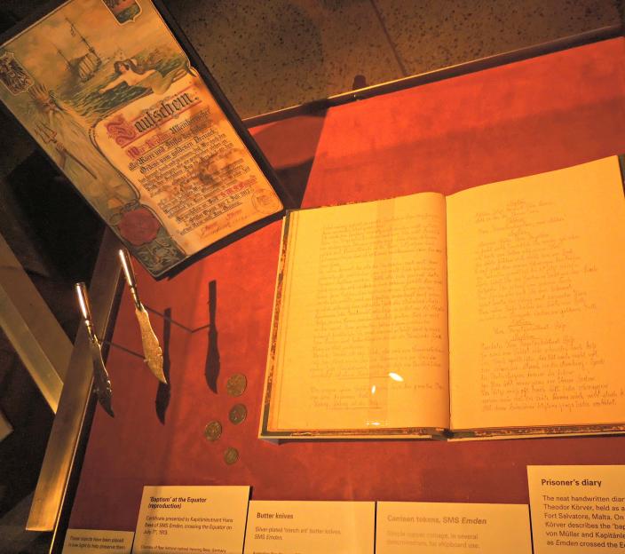 Display case showing artefacts such as a prisoner's diary