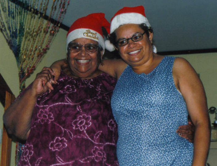 "Two women standing side by side. They are mother and daughter."