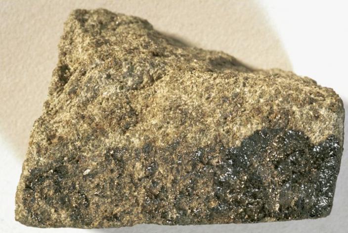Image of the brown-grey meteorite Nakhla, on display the WA Museum.